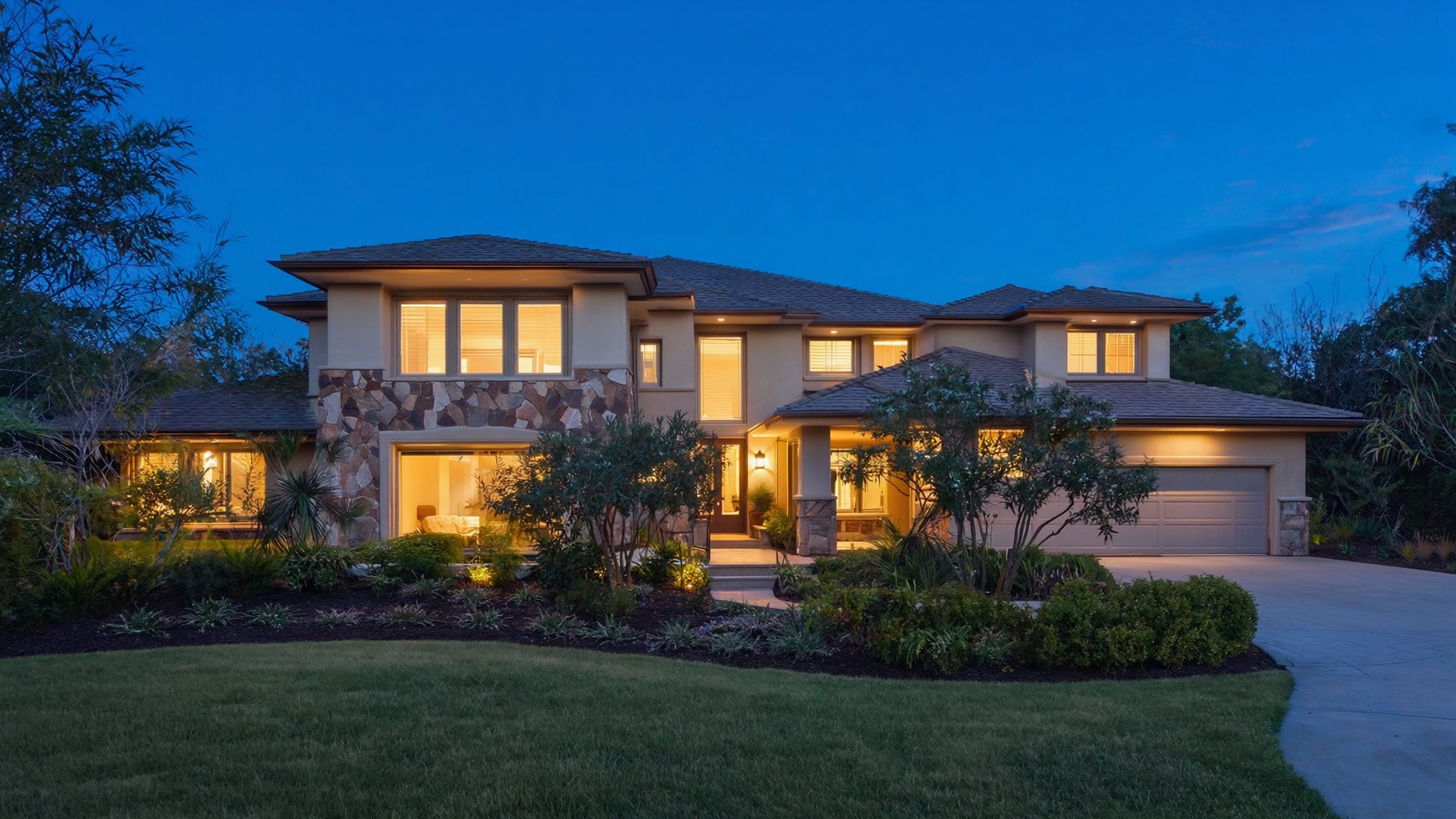 A home at twilight with the lights on